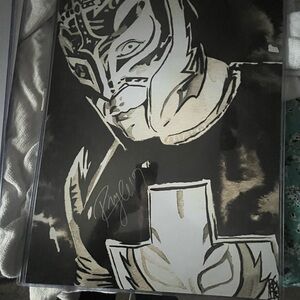 Rey mysterio autograph 16x20 comes in a top loader